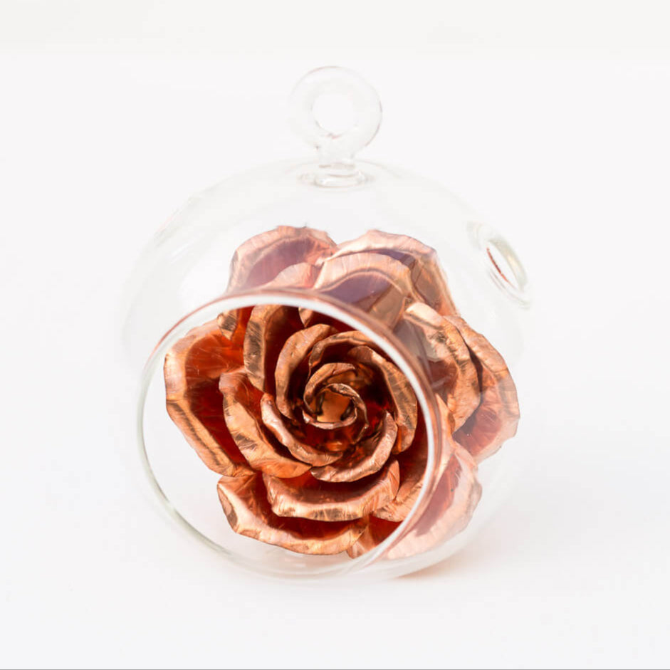 Copper rose in glass bauble