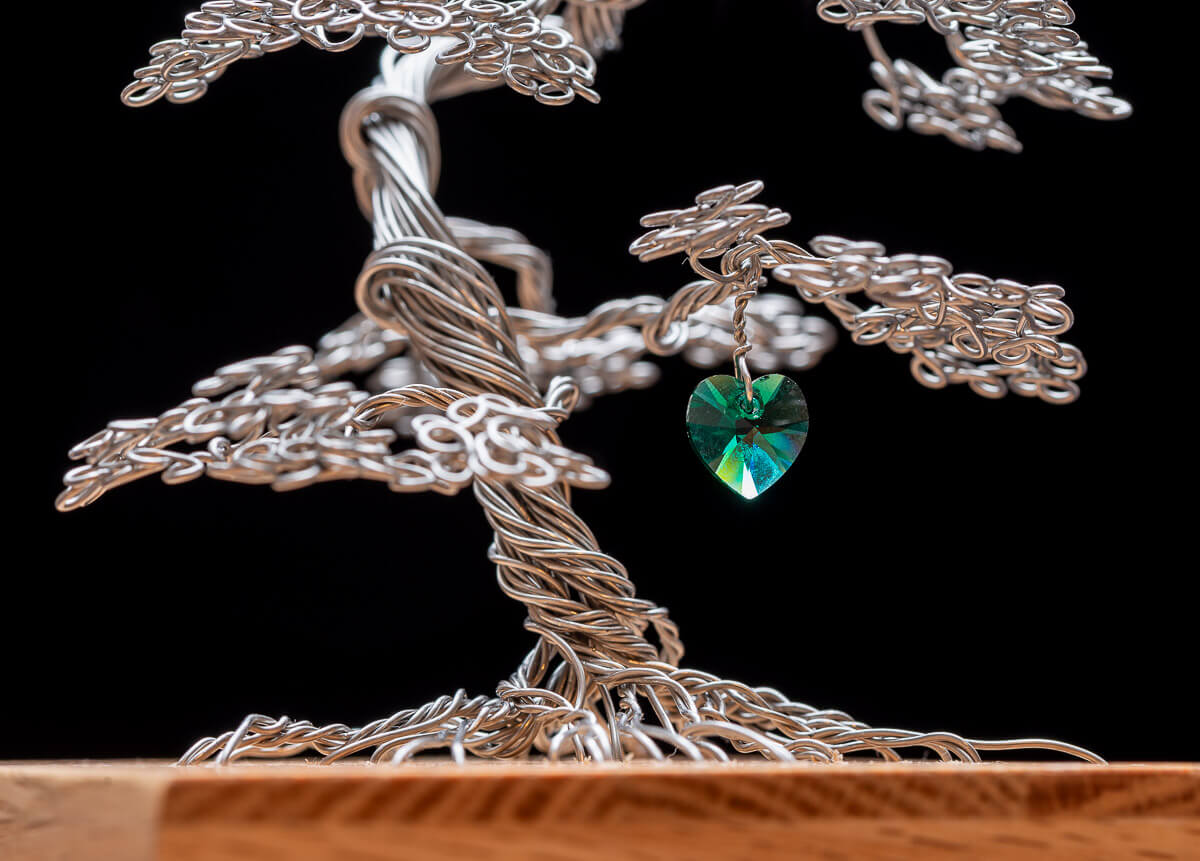 Memory box, memorial tree in stainless steel mounted on a solid oak box, lined with black velour. Shown with emerald green crystal heart.