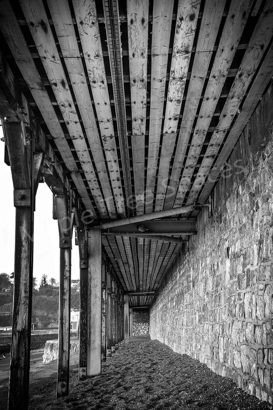 Prints Alone Under Dawlish Platform Black and white image leading lines