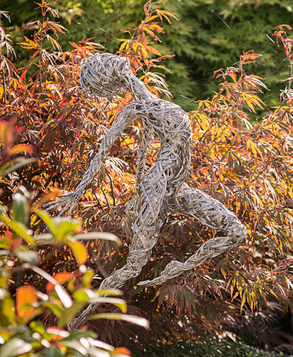 Garden sculpture Freedom with maple trees